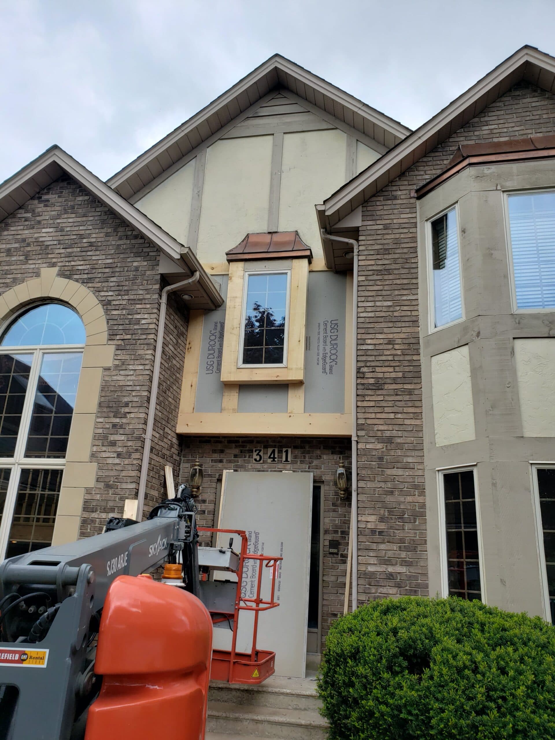 Exterior renovation in progress on a Windsor home by Daedalus Carpentry