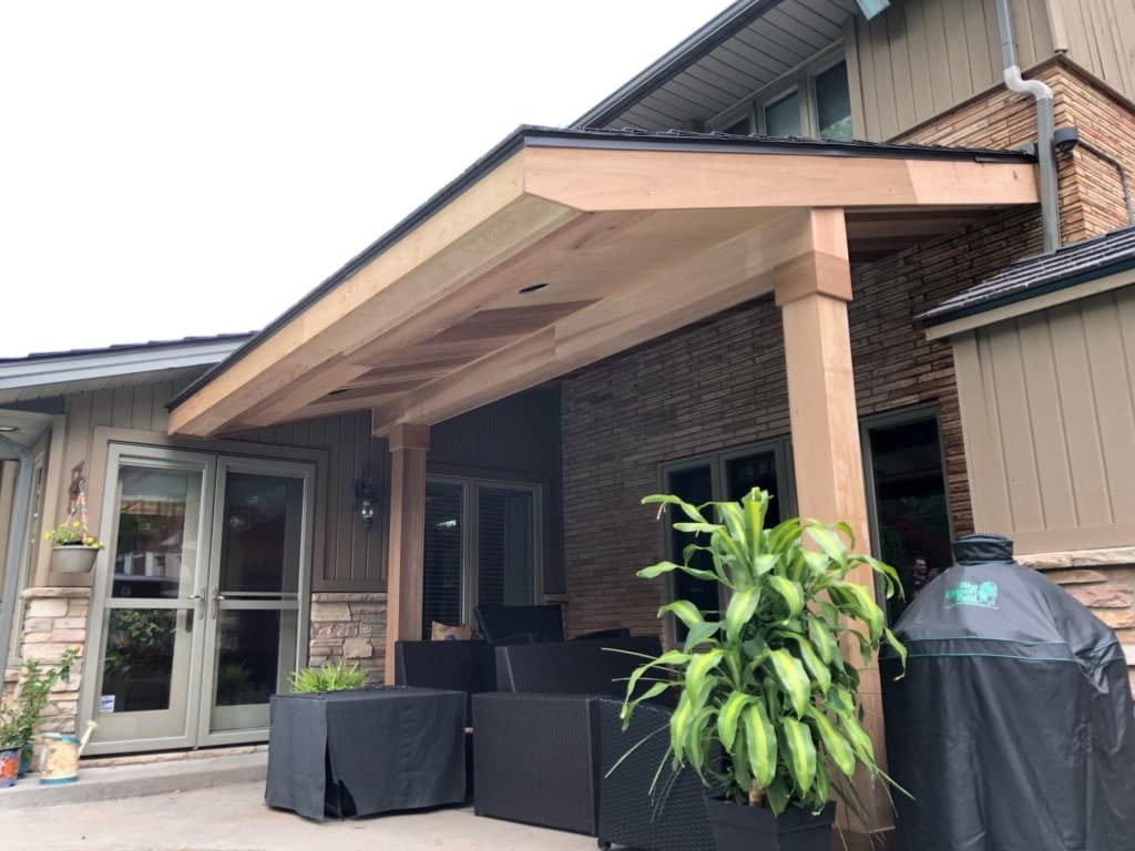 Custom cedar covered porch built by Daedalus Carpentry